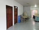 Hallway with wooden doors and furniture