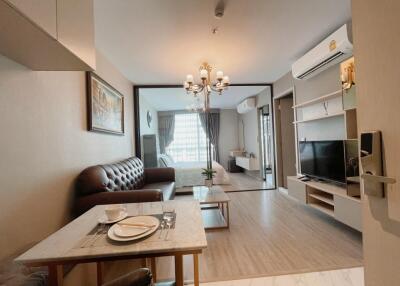 Modern living room with a view of the bedroom