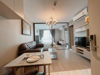 Modern living room with a view of the bedroom