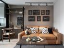 A modern living room with a brown sofa, wall decorations, a coffee table and a desk area.