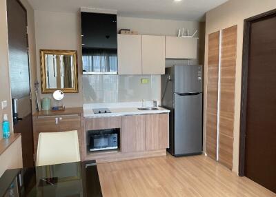 Modern kitchen with built-in appliances and wooden cabinetry