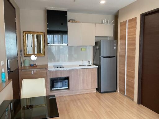 Modern kitchen with built-in appliances and wooden cabinetry