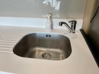 Modern kitchen sink with clean faucet