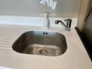 Modern kitchen sink with clean faucet