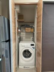 Compact laundry space with washing machine