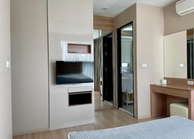 Modern bedroom with TV and vanity desk