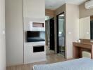 Modern bedroom with TV and vanity desk