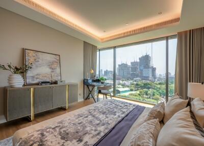 Modern bedroom with large windows and city view