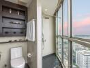 Modern high-rise bathroom with large windows