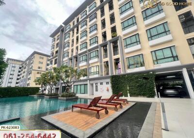 Exterior view of a modern apartment building with a swimming pool