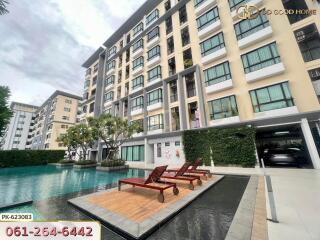 Exterior view of a modern apartment building with a swimming pool