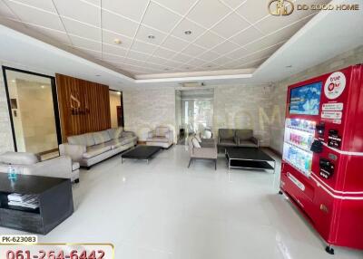 Modern lobby with vending machine and seating area