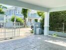 Covered driveway with view of surrounding residential area