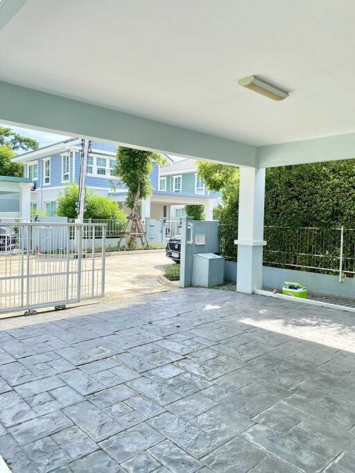 Covered driveway with view of surrounding residential area