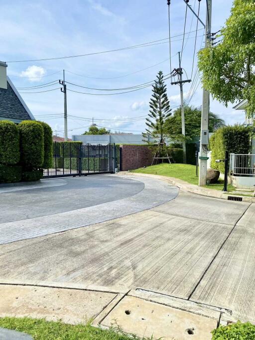 Entrance with gate and driveway