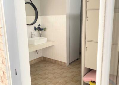 Modern bathroom with sink and storage lockers