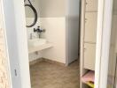 Modern bathroom with sink and storage lockers