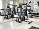 Home gym with exercise equipment and large mirror