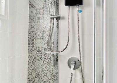 Modern bathroom shower with decorative tiles
