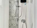 Modern bathroom shower with decorative tiles