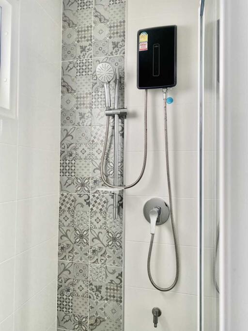 Modern bathroom shower with decorative tiles