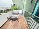 Spacious balcony with seating area and plants