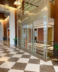 Spacious modern building lobby with checkered floor