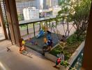 Outdoor play area with playground equipment and seating