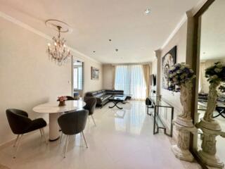 Modern living room with dining area and chandelier