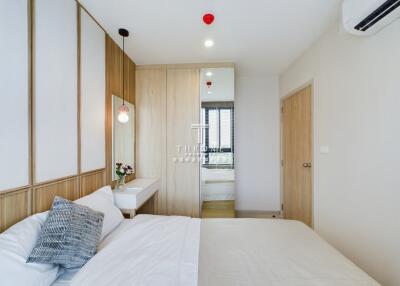 Modern bedroom with white and wood decor