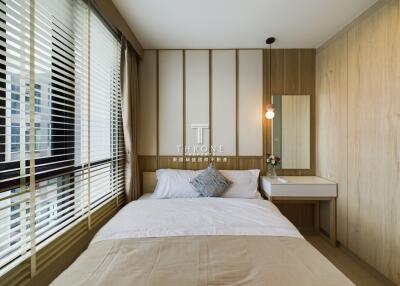 Modern bedroom with large window and natural light