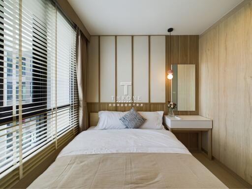 Modern bedroom with large window and natural light