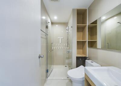 Modern bathroom with shower and storage space