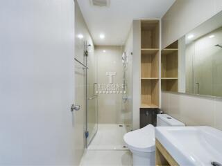 Modern bathroom with shower and storage space