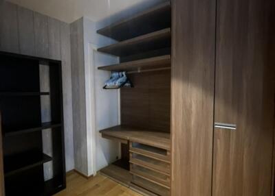 Spacious walk-in closet with shelving and hanging space