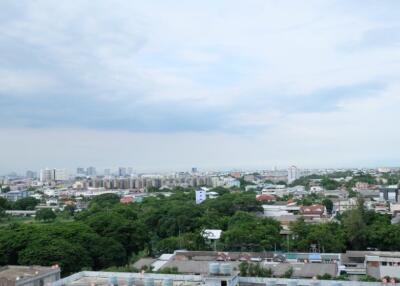 City skyline view with buildings and green spaces