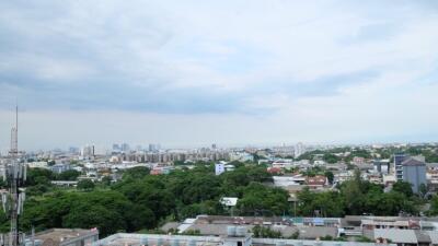 City skyline view with buildings and green spaces