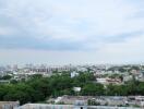 City skyline view with buildings and green spaces