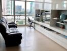 Modern living room with large windows and city view