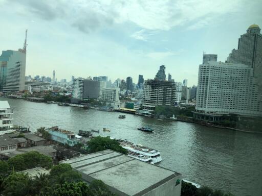 View of river and cityscape with high-rise buildings