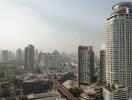 Skyline view of city with tall buildings and train tracks