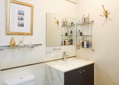 Modern bathroom with vanity and wall-mounted shelves