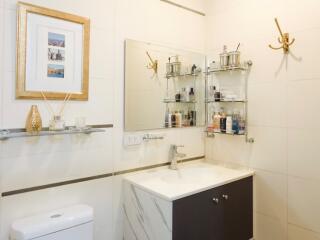 Modern bathroom with vanity and wall-mounted shelves