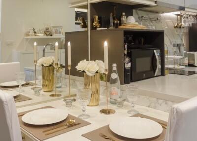 Dining area with a view of a modern kitchen