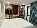 Spacious bedroom with large bed and wardrobe