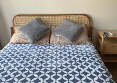 Photo of a cozy bedroom with a double bed and a bedside table