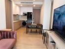 Modern living area with kitchenette and dining table