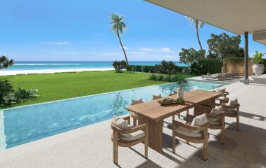 Outdoor seating area with pool and ocean view