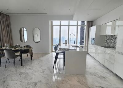 Modern kitchen with dining area and large windows