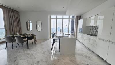 Modern kitchen with dining area and large windows